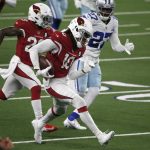 Arizona Cardinals' DeAndre Hopkins (10) carries the ball for a long gain after catching a pass as Dallas Cowboys' Trevon Diggs (27) gives chase in the second half of an NFL football game in Arlington, Texas, Monday, Oct. 19, 2020. (AP Photo/Michael Ainsworth)