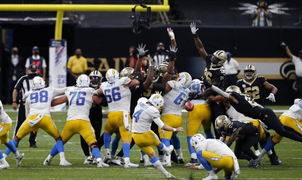 Los Angeles Chargers kicker Mike Badgley (4) attempts a field goal that was no good, forcing overti...