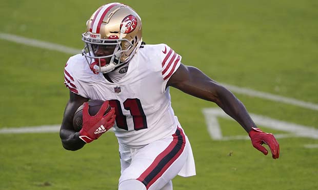 San Francisco 49ers wide receiver Brandon Aiyuk (11) runs against the Los Angeles Rams during the f...