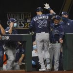 Tampa Bay Rays' Kevin Kiermaier celebrates in the dugout after a home run against the Los Angeles Dodgers during the fifth inning in Game 1 of the baseball World Series Tuesday, Oct. 20, 2020, in Arlington, Texas. (AP Photo/Eric Gay)