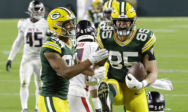 Green Bay Packers' Robert Tonyan (85) celebrates a touchdown reception with Malik Taylor (86) durin...