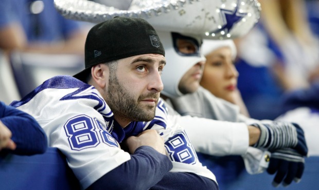 A Dallas Cowboys fan disappointed after his team loses to the Indianapolis Colts at Lucas Oil Stadi...
