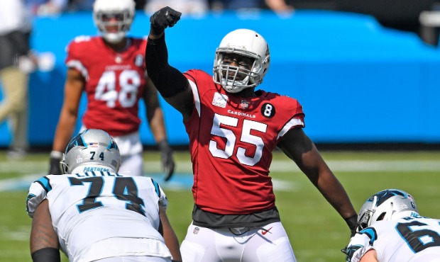 Chandler Jones #55 of the Arizona Cardinals gestures to the official after a false start by the Car...