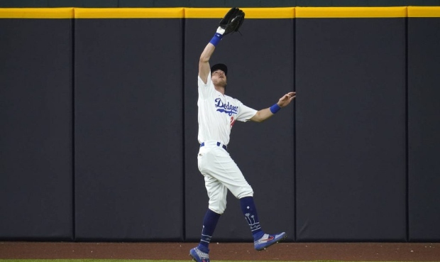 Los Angeles Dodgers' Cody Bellinger (35) fields a fly out by San Diego Padres' Jurickson Profar dur...