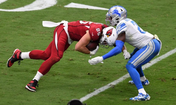 Tracy Walker #21 of the Detroit Lions tackles Dan Arnold #85 of the Arizona Cardinals during the se...