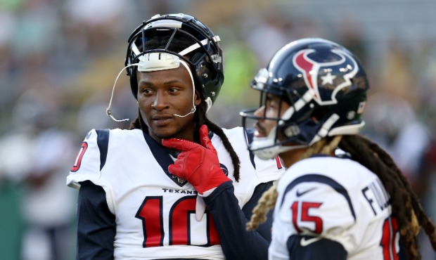 DeAndre Hopkins #10 and Will Fuller V #15 of the Houston Texans warm up before a preseason game aga...