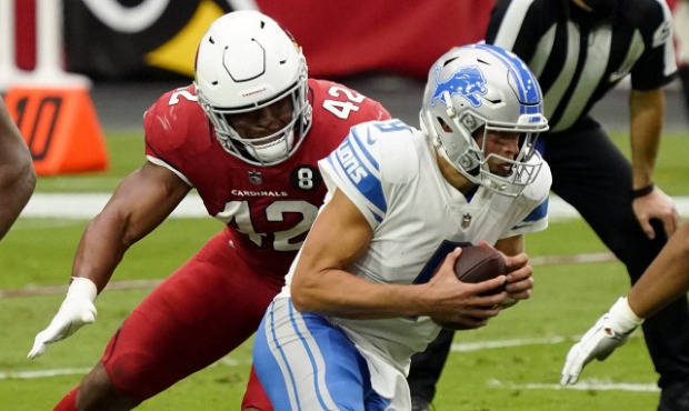 Detroit Lions quarterback Matthew Stafford (9) is sacked by Arizona Cardinals outside linebacker De...