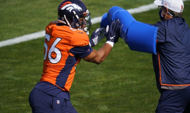 Denver Broncos linebacker Isaiah Irving takes part in drills during an NFL football practice at the...