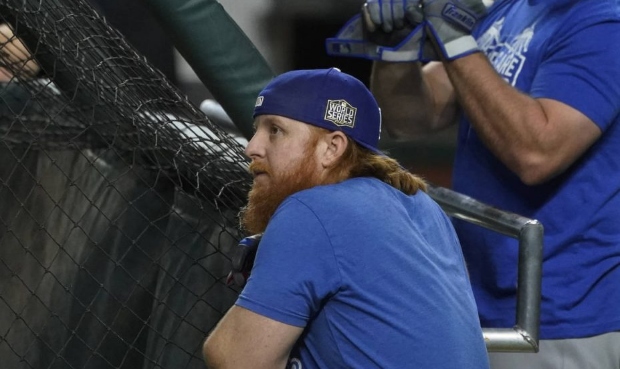 Los Angeles Dodgers third baseman Justin Turner watches during batting practice before Game 5 of th...