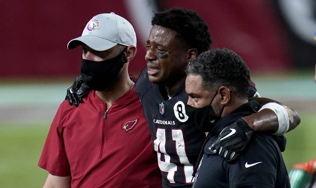 Arizona Cardinals running back Kenyan Drake (41) is helped off the field after an injury during the...