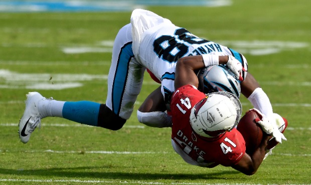 Myles Hartsfield #38 of the Carolina Panthers tackles Kenyan Drake #41 of the Arizona Cardinals dur...