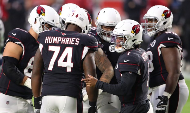 Quarterback Kyler Murray #1 of the Arizona Cardinals looks toward the side line from the huddle for...