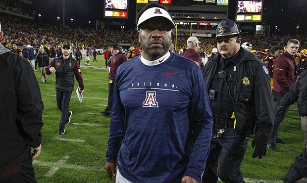 Arizona coach Kevin Sumlin walks off the field after his team's 24-14 loss to Arizona State in an N...