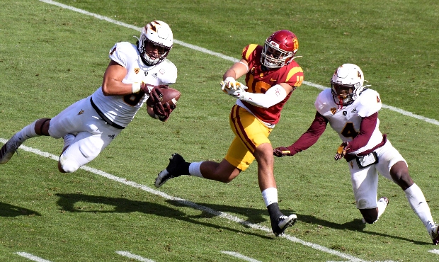 Linebacker Merlin Robertson #8 of the Arizona State Sun Devils intercepts a pass intended for tight...