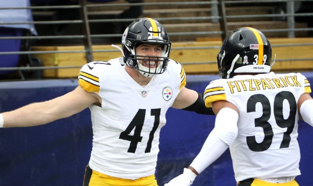Linebacker Robert Spillane #41 of the Pittsburgh Steelers celebrates with free safety Minkah Fitzpa...