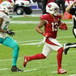 Arizona Cardinals wide receiver Christian Kirk (13) scores a touchdown as Miami Dolphins cornerback Byron Jones (24) pursues during the first half of an NFL football game, Sunday, Nov. 8, 2020, in Glendale, Ariz. (AP Photo/Rick Scuteri)