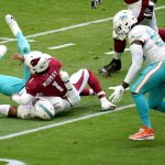 Miami Dolphins defensive end Emmanuel Ogbah (91) forces Arizona Cardinals quarterback Kyler Murray (1) to fumble during the first half of an NFL football game, Sunday, Nov. 8, 2020, in Glendale, Ariz. Dolphins' defensive end Shaq Lawson, right, recovered the ball for a touchdown. (AP Photo/Ross D. Franklin)