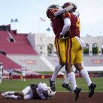 Southern California wide receiver Bru McCoy (4) celebrates with Amon-Ra St. Brown (8) after catching a pass in the end zone for a touchdown against Arizona State during the second half of an NCAA college football game Saturday, Nov. 7, 2020, in Los Angeles. (AP Photo/Ashley Landis)