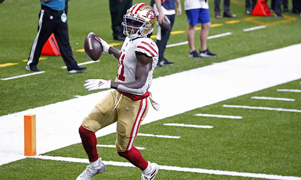San Francisco 49ers wide receiver Brandon Aiyuk (11) crosses the goal line on a touchdown reception...
