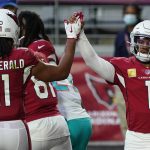 Arizona Cardinals quarterback Kyler Murray (1) high fives wide receiver Larry Fitzgerald (11) after scoring a touchdown against the Miami Dolphins during the second half of an NFL football game, Sunday, Nov. 8, 2020, in Glendale, Ariz. (AP Photo/Rick Scuteri)