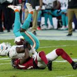 Arizona Cardinals cornerback Patrick Peterson takes Miami Dolphins wide receiver DeVante Parker, top, during the second half of an NFL football game, Sunday, Nov. 8, 2020, in Glendale, Ariz. (AP Photo/Ross D. Franklin)