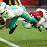 Miami Dolphins wide receiver Preston Williams (18) falls in for a touchdown as Arizona Cardinals free safety Jalen Thompson (34) defends during the first half of an NFL football game, Sunday, Nov. 8, 2020, in Glendale, Ariz. (AP Photo/Rick Scuteri)