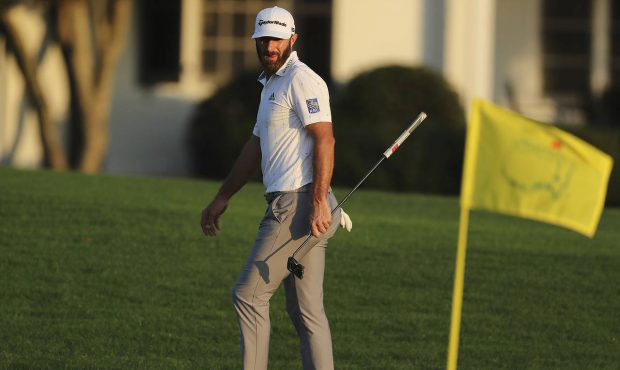 Dustin Johnson eyes the Masters' flag and his first green jacket finishing on the 18th green with a...