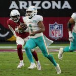 Miami Dolphins quarterback Tua Tagovailoa (1) runs as Arizona Cardinals outside linebacker Haason Reddick (43) pursues during the second half of an NFL football game, Sunday, Nov. 8, 2020, in Glendale, Ariz. (AP Photo/Rick Scuteri)