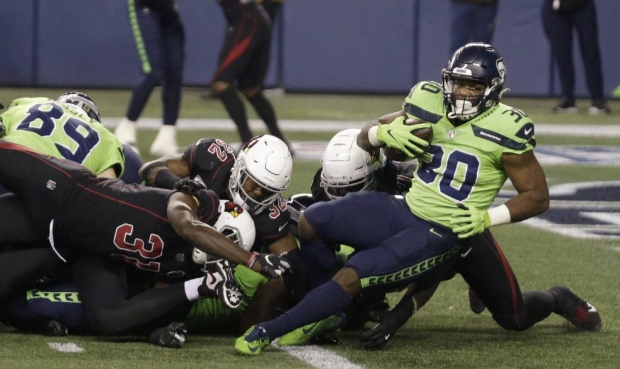Seattle Seahawks running back Carlos Hyde (30) scores a touchdown against the Arizona Cardinals dur...