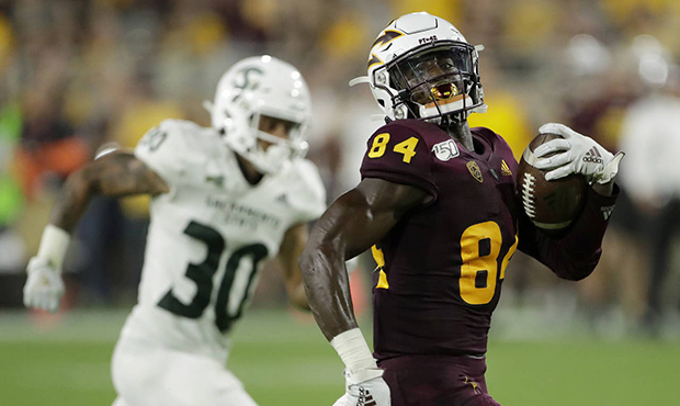 Arizona State wide receiver Frank Darby (84) runs with a reception as Sacramento State defensive ba...