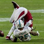 Miami Dolphins cornerback Xavien Howard (25) breaks up a pass intended for Arizona Cardinals wide receiver DeAndre Hopkins during the second half of an NFL football game, Sunday, Nov. 8, 2020, in Glendale, Ariz. (AP Photo/Ross D. Franklin)