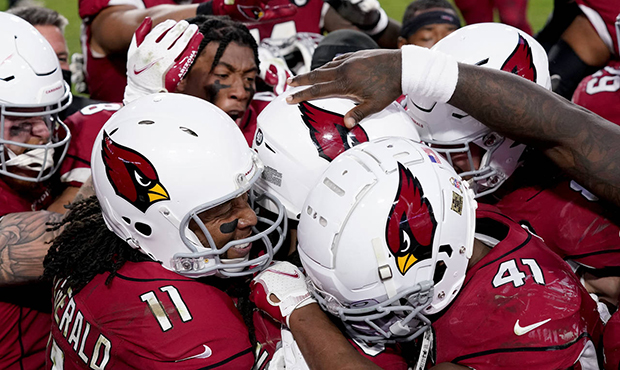 The Arizona Cardinals celebrate after their game winning touchdown against the Buffalo Bills during...