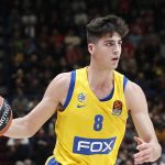 FILE - In this Nov. 19, 2019, file photo, Maccabi Fox Tel Aviv's Deni Avdija controls the ball during the Euro League basketball match between Olimpia Milan and Maccabi Fox Tel Aviv, in Milan, Italy. Avdija is a potential lottery pick and one of the top forwards in next week's NBA draft. There were 108 international players on opening-night rosters for the 2019-20 season. That number could increase this year and Avdija will be one of the new faces (AP Photo/Antonio Calanni, File)
