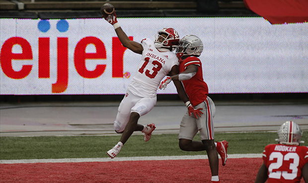 Ohio State defensive back Sevyn Banks, right, breaks up a pass intended for Indiana receiver Miles ...