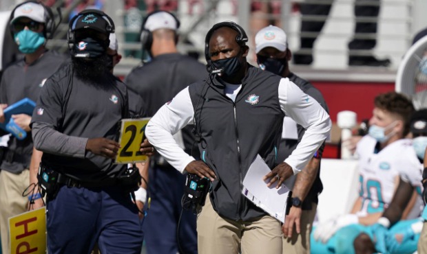 Miami Dolphins head coach Brian Flores watches on the sideline during the first half of an NFL foot...