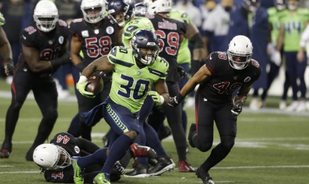 Seattle Seahawks running back Carlos Hyde (30) rushes against the Arizona Cardinals during the firs...