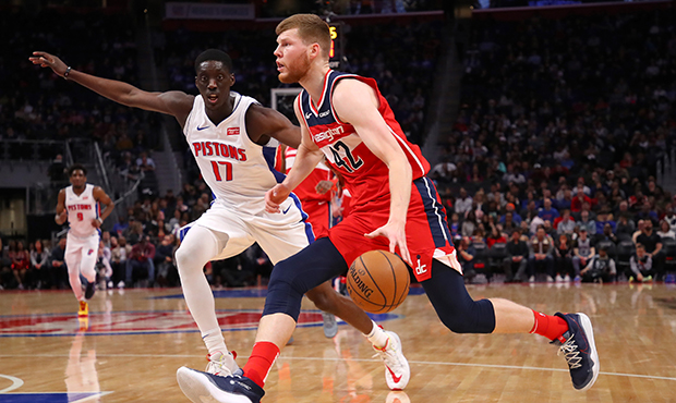 Davis Bertans #42 of the Washington Wizards drives around Tony Snell #17 of the Detroit Pistons dur...