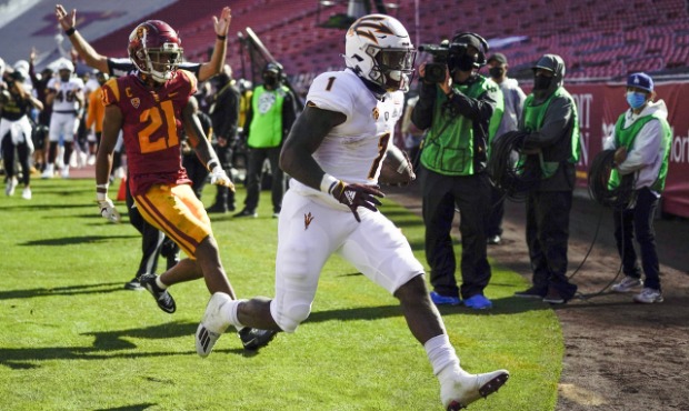 Arizona State running back Chip Trayanum (1) scores a touchdown ahead of Southern California safety...