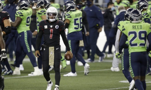 Arizona Cardinals quarterback Kyler Murray (1) walks on the field after being sacked late in the fo...