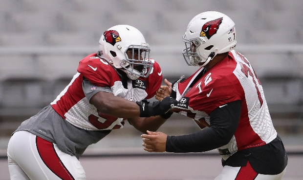 Defensive tackle Trevon Coley #93 of the Arizona Cardinals works on drills with defensive tackle Mi...