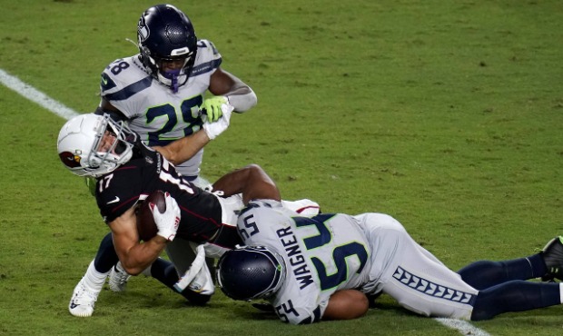 Arizona Cardinals wide receiver Andy Isabella (17) is hit by Seattle Seahawks middle linebacker Bob...