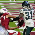 Arizona Cardinals wide receiver Larry Fitzgerald (11) pulls in a touchdown catch as Philadelphia Eagles cornerback Nickell Robey-Coleman (31) defends during the first half of an NFL football game, Sunday, Dec. 20, 2020, in Glendale, Ariz. (AP Photo/Rick Scuteri)