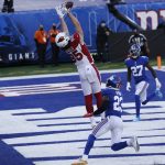 Arizona Cardinals' Dan Arnold, center, catches a pass for a touchdown during the first half of an NFL football game against the New York Giants, Sunday, Dec. 13, 2020, in East Rutherford, N.J. (AP Photo/Noah K. Murray)
