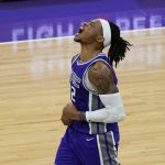 Sacramento Kings center Richaun Holmes celebrates after scoring and being fouled during the closing moments of the Kings' 106-103 win over the Phoenix Suns in an NBA basketball game in Sacramento, Calif., Saturday, Dec. 26, 2020. (AP Photo/Rich Pedroncelli)