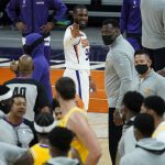 Phoenix Suns forward Jae Crowder (99) motions to Los Angeles Lakers forward Marc Gasol during the first half of a preseason basketball game, Friday, Dec. 18, 2020, in Phoenix, Ariz. (AP Photo/Matt York)