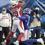 New York Giants' James Bradberry, right, breaks up a pass in the end zone intended for Arizona Cardinals' KeeSean Johnson (19) during the first half of an NFL football game, Sunday, Dec. 13, 2020, in East Rutherford, N.J. (AP Photo/Bill Kostroun)