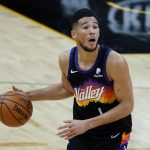 Phoenix Suns guard Devin Booker reacts to a call during the second half of the team's NBA basketball game against the New Orleans Pelicans, Tuesday, Dec. 29, 2020, in Phoenix. (AP Photo/Rick Scuteri)