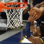 Utah Jazz guard Donovan Mitchell (45) goes to the basket during the second half of an NBA basketball game against the Phoenix Suns on Thursday, Dec. 31, 2020, in Salt Lake City. (AP Photo/Rick Bowmer)