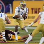 UCLA quarterback Dorian Thompson-Robinson (1) scrambles during the first half of the team's NCAA college football game against Arizona State, Saturday, Dec. 5, 2020, in Tempe, Ariz. (AP Photo/Matt York)