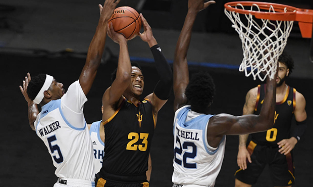 Arizona State's Marcus Bagley, center, goes up for a shot as Rhode Island's Antwan Walker, left, an...